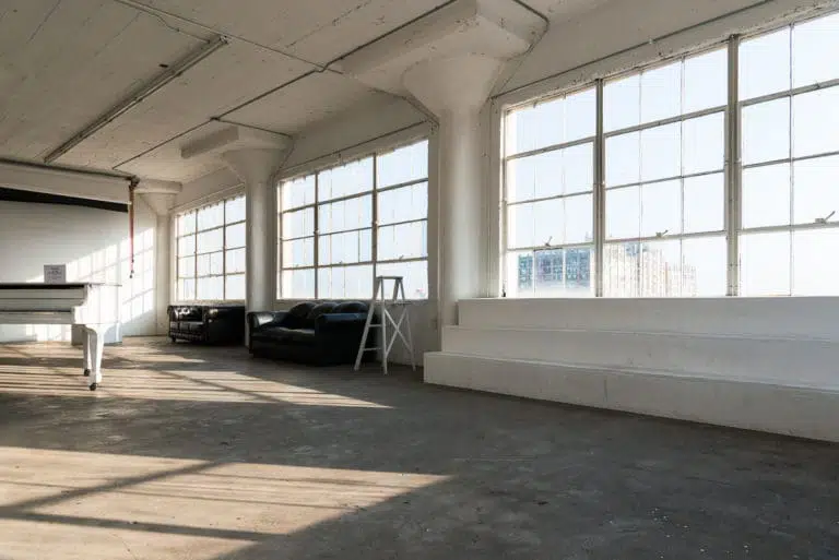 natural light photo studio with white staircase
