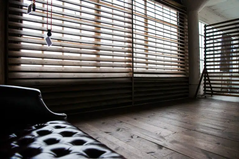 Stage with a wooden corner, large blinds and a marquee star available for rental in Los Angeles