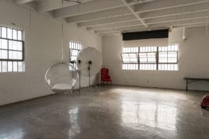 Stage Upgrade: Hill 6 New Cool Props -transparent egg-shaped hanging chai, Studio News, Rental Studio, Renovation, red leather lounge chair, Photo Blog, Los Angeles, LA Rental Studio, Hill Location, Hill 6, grass wall with white flowers, gloss floor, FD photo studio, DTLA, Announcement