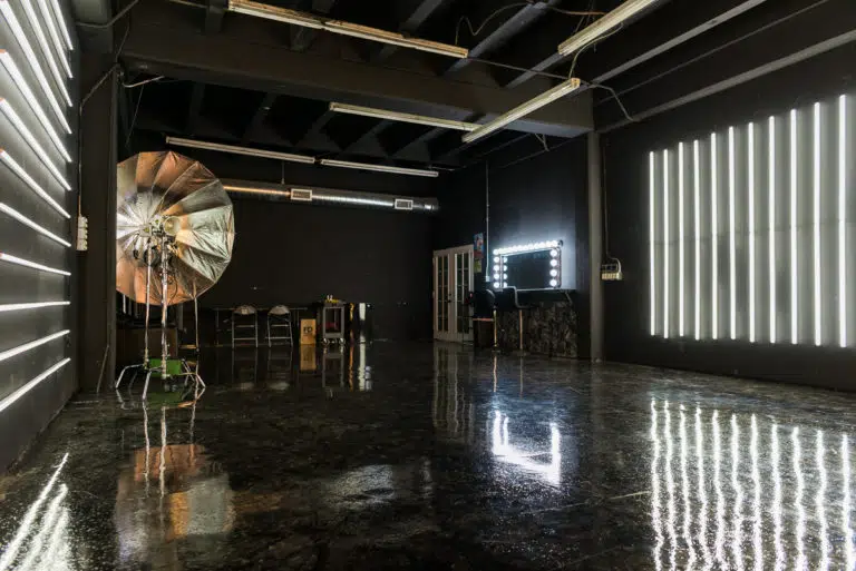 LED dimmable lights & black glossy floor blackout stage is available for photo and video rentals in Los Angeles