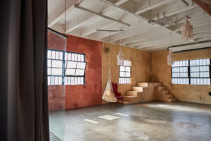 Ashley BeLoat In Hill 6 -transparent egg-shaped hanging chai, Studio News, shower, Rental Studio, red leather lounge chair, Photo Blog, moroccan tile shower corner, Los Angeles, LA Rental Studio, Hill6, Hill Location, Hill 6, grass wall with white flowers, gloss floor, garland wall, FD photo studio, DTLA, Ashley BeLoat In Hill 6