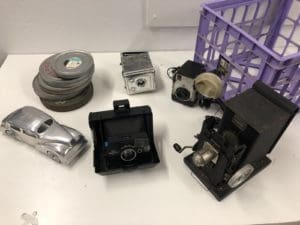 Stage UPGRADE:  Textured walls, dark stained shelves & cool props in stage D! -textured wall, textured door, Studio News, stage update, Shoot Location, set design, Rental Studio, Renovation, Photoshop, Photoshoot, photography services, photographer, Photo Studio, new stage, natural light studio, Main location, Los Angeles, Filming Location, film canisters, FD photo studio, DTLA, dark stained wooden shelf, ambient light studio, !done