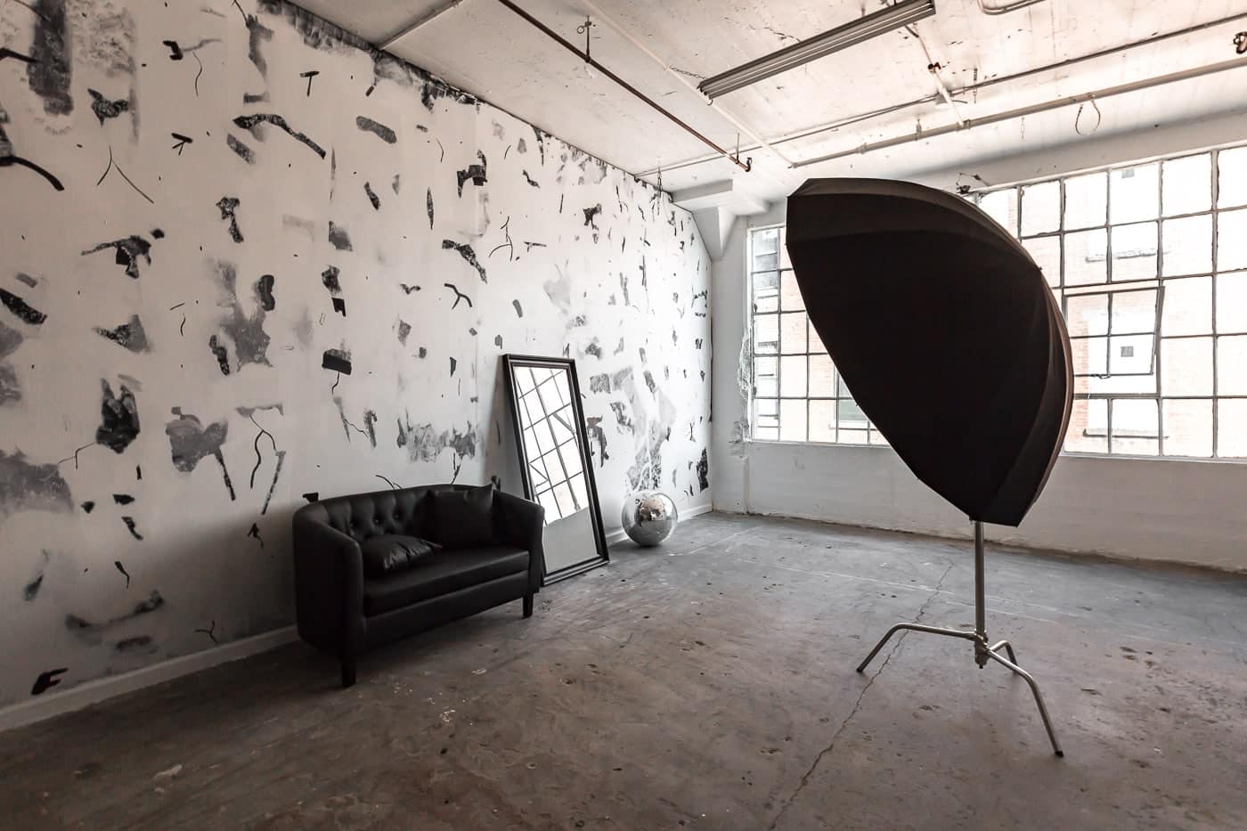 Photo studio with artistic wall