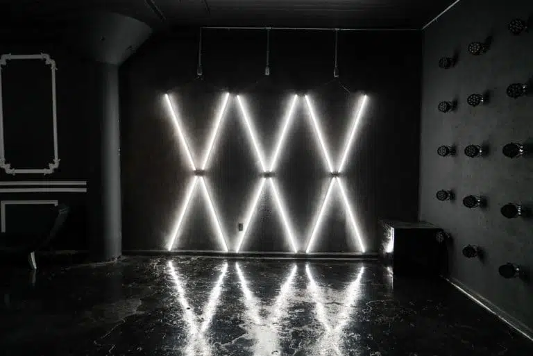 Affordable photo studio with 4 different sets, RGB lights, furniture and additional grip & strobes included, available for rent hourly near New York.