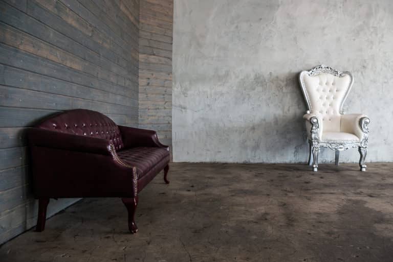 Photo and Video studio with concrete textured wall, red sofa and white extra large chair available for rental In Los Angeles Photo and Video studio with concrete textured wall, red sofa and white extra large chair available for rental In Los Angeles