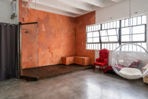 Ashley BeLoat In Hill 6 -transparent egg-shaped hanging chai, Studio News, shower, Rental Studio, red leather lounge chair, Photo Blog, moroccan tile shower corner, Los Angeles, LA Rental Studio, Hill6, Hill Location, Hill 6, grass wall with white flowers, gloss floor, garland wall, FD photo studio, DTLA, Ashley BeLoat In Hill 6