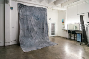 NEW PROPS: Grey Textured Fabric Backdrop in Studio Hill 6 -transparent egg-shaped hanging chai, Studio News, shower, Rental Studio, Renovation, red leather lounge chair, Photo Blog, moroccan tile shower corner, Los Angeles, LA Rental Studio, Hill Location, Hill 6, grey textured fabric backdrop, grass wall with white flowers, gloss floor, garland wall, FD photo studio, DTLA, Announcement