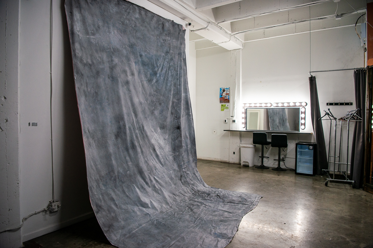 Grey textured fabric backdrop available for rental with Hill 6 photo studio