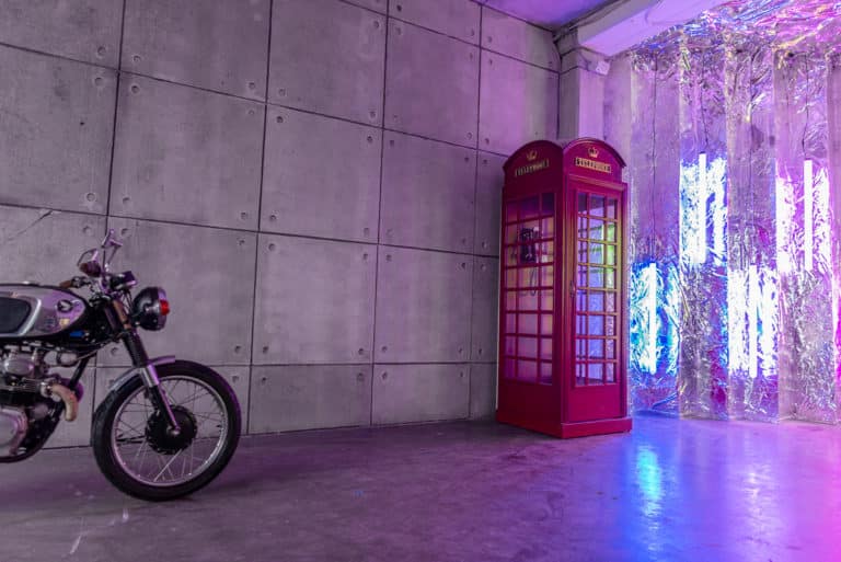 Atmospheric Textured Grey Concrete Wall with Motorcycle and Red Phone Booth available with Hill 8 photo studio rental Atmospheric Textured Grey Concrete Wall with Motorcycle and Red Phone Booth available with Hill 8 photo studio rental