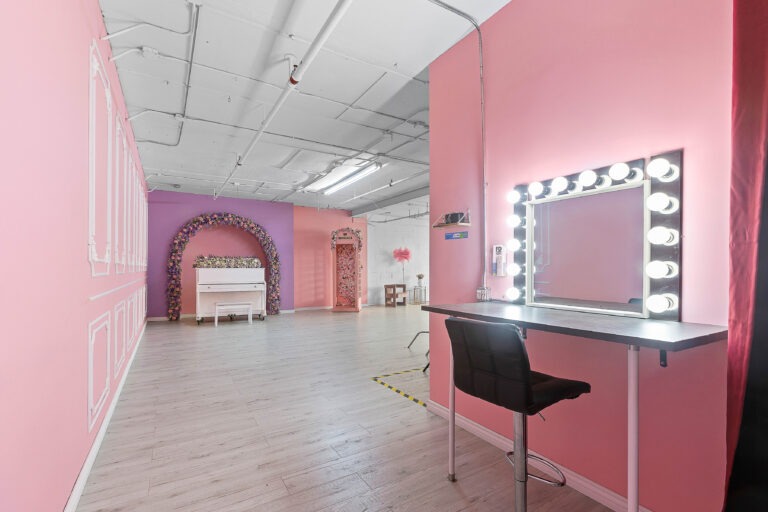 Rental photo studio with hardwood floors, big North facing window, and a pink photo booth - Astoria 3