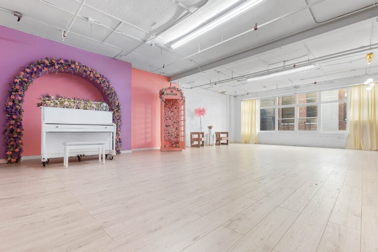 Rental photo studio with hardwood floors, big North facing window, and a pink photo booth - Astoria 3