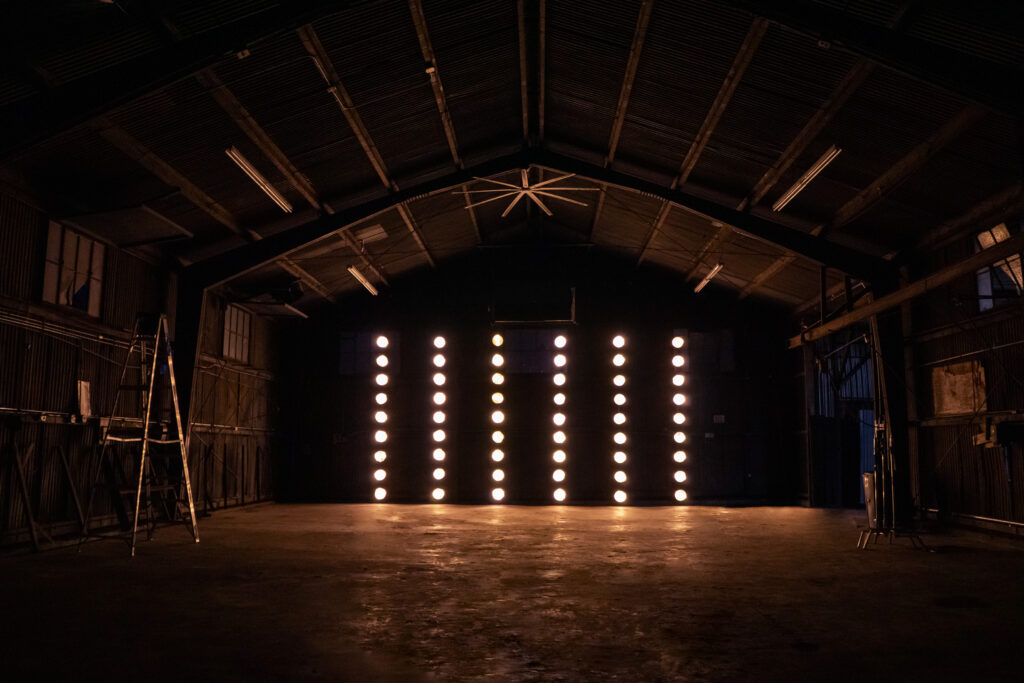 Olympic 5 - Huge metal hangar with car access and dedicated production room, restrooms and MUA tables for rent for photo and filming productions
