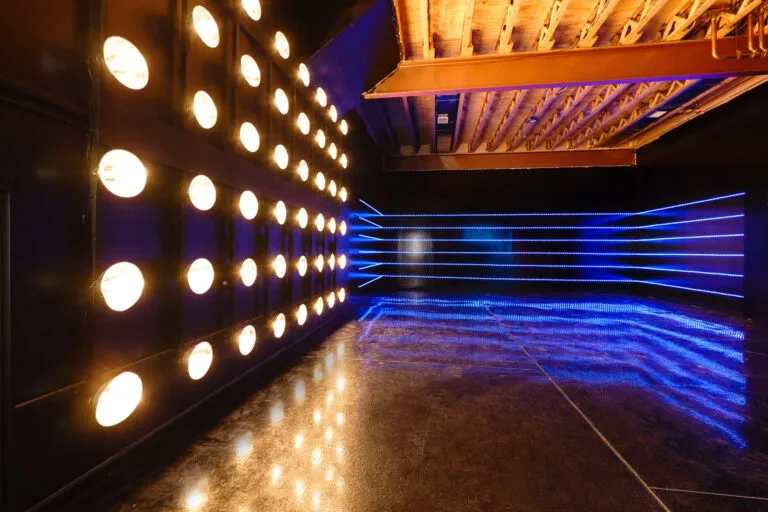 Large blackout studio with high ceilings, a Sport Bike, controllable sound synchronized RGB Lights, and RGB Tunnel for car photo and video shoots Chicago 1